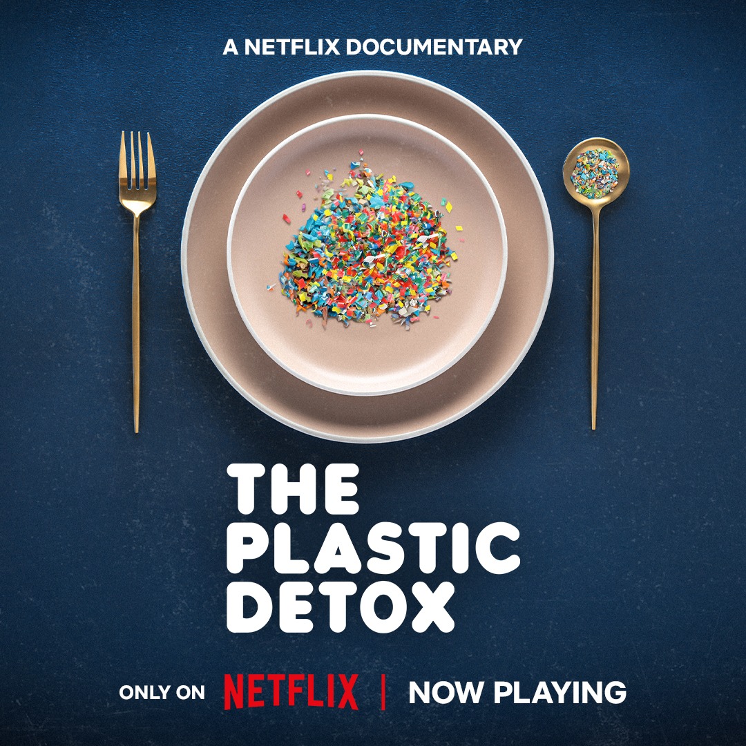 Colorful plastic fragments are arranged on a simple plate, accompanied by a gold fork and spoon. Promotes the Netflix documentary "The Plastic Detox."